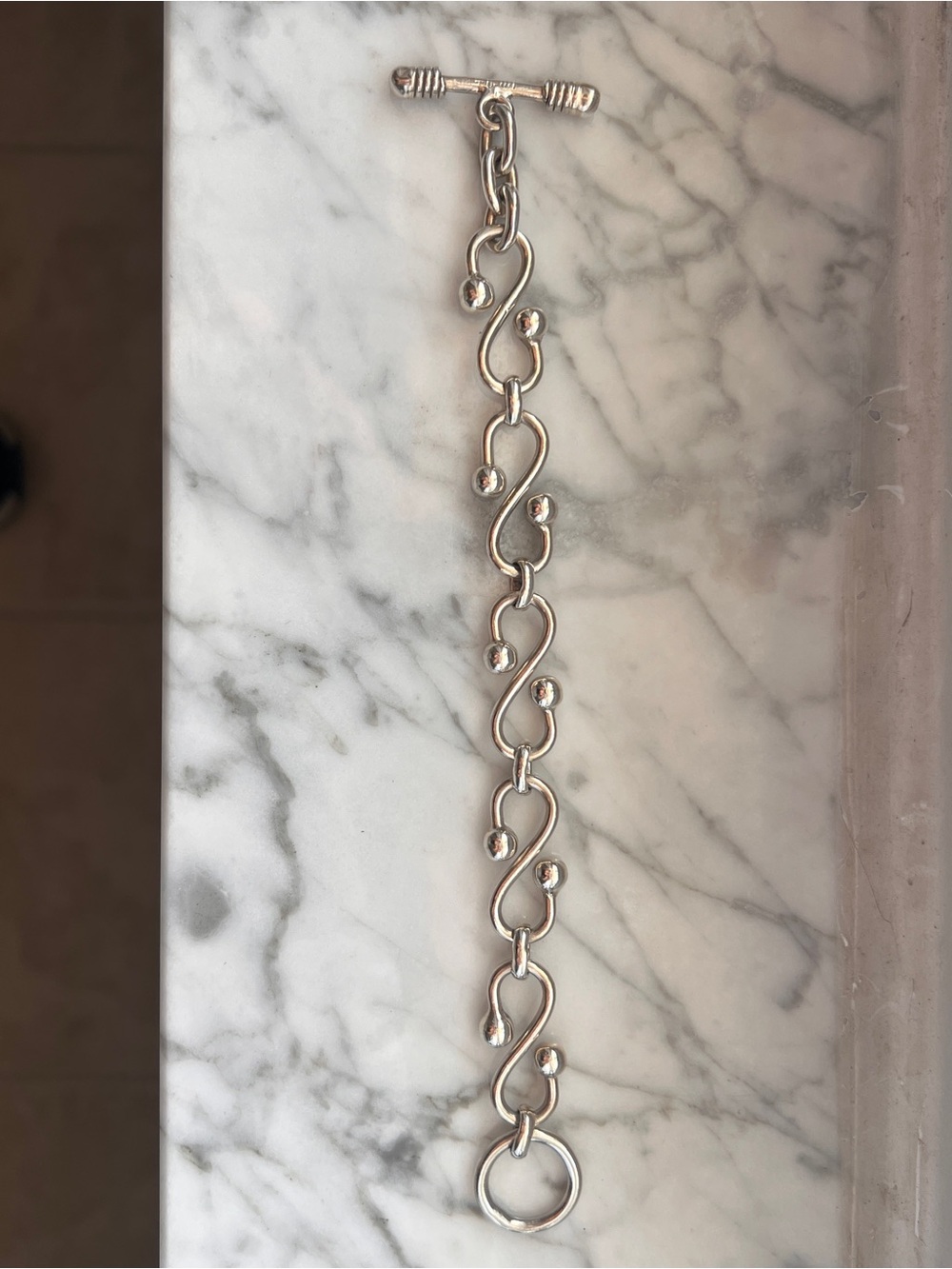 Silver 7.5 inch S-Shaped Solid Toggle Bracelet with Polished Ball Accents - Picture 3 of 11